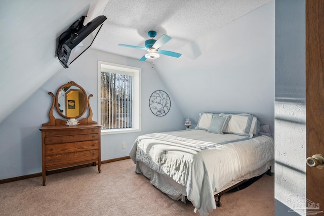bedroom with carpet flooring, a ceiling fan, a textured ceiling, lofted ceiling, and baseboards