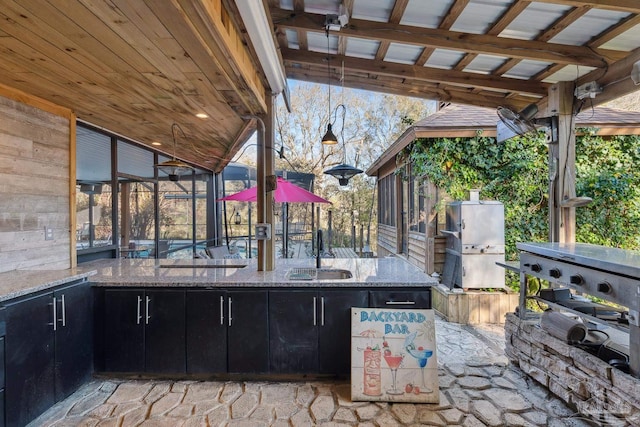 view of patio / terrace featuring a sink