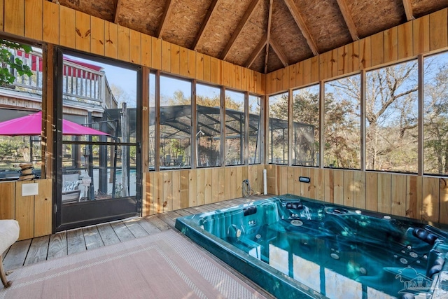 unfurnished sunroom featuring a jacuzzi