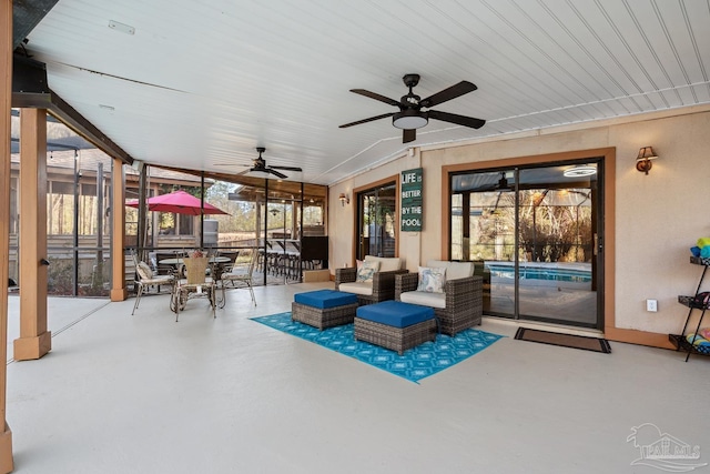 view of patio / terrace with outdoor lounge area, ceiling fan, outdoor dining space, and a lanai