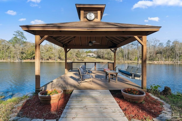 dock area with a deck with water view and a gazebo