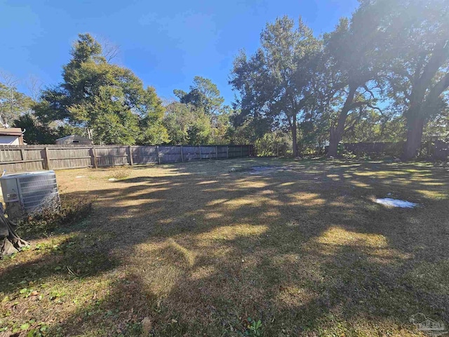 view of yard featuring central air condition unit