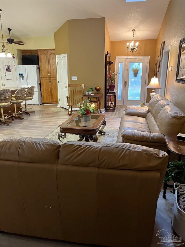 10800 Beulah Rd Unit A & B, Pensacola, FL 32526 - living room with a chandelier, light wood-type flooring, and a ceiling fan