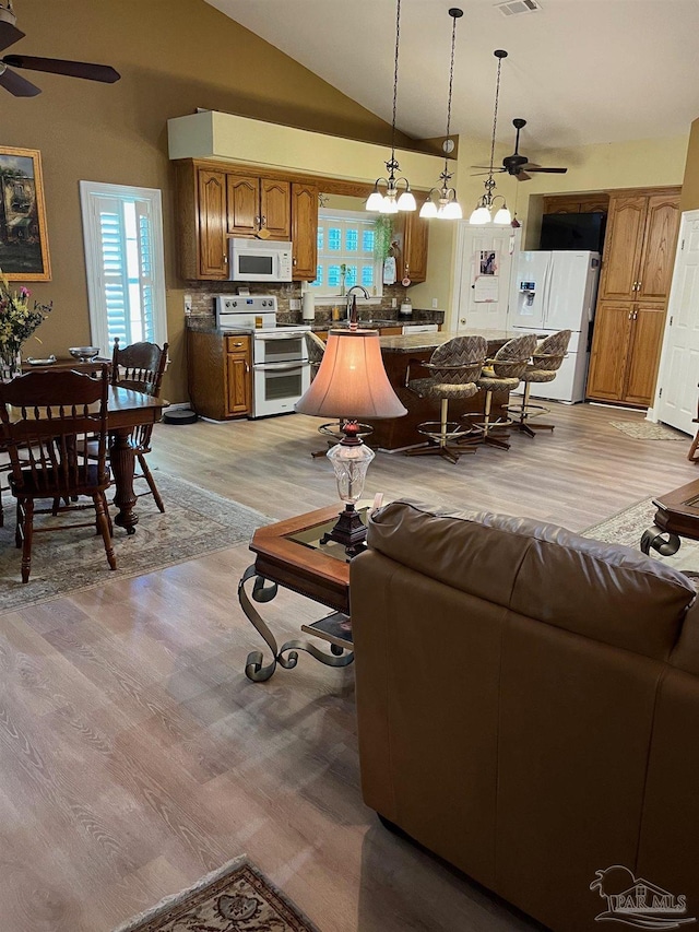 10800 Beulah Rd Unit A & B, Pensacola, FL 32526 - living area with a ceiling fan, light wood finished floors, and vaulted ceiling