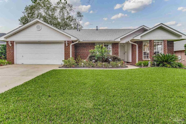 ranch-style home featuring a garage and a front yard