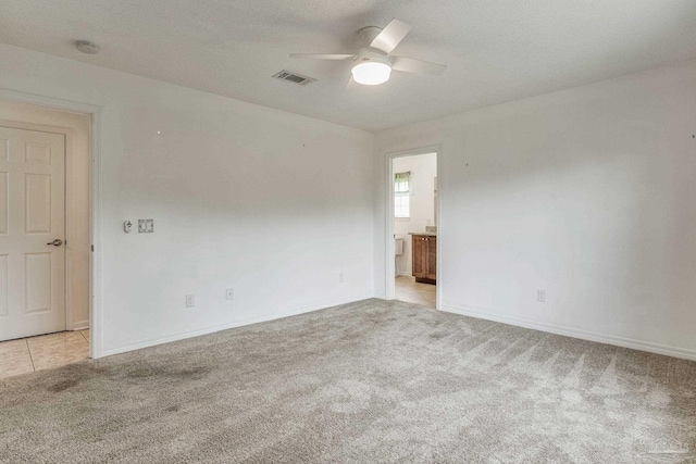 empty room with light carpet and ceiling fan