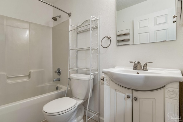 full bathroom featuring vanity, toilet, washtub / shower combination, and a textured ceiling