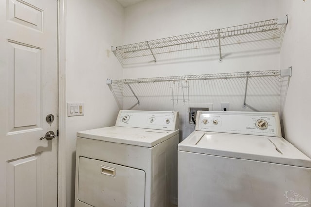 washroom with washer and clothes dryer