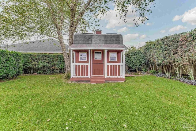 view of outbuilding featuring a yard