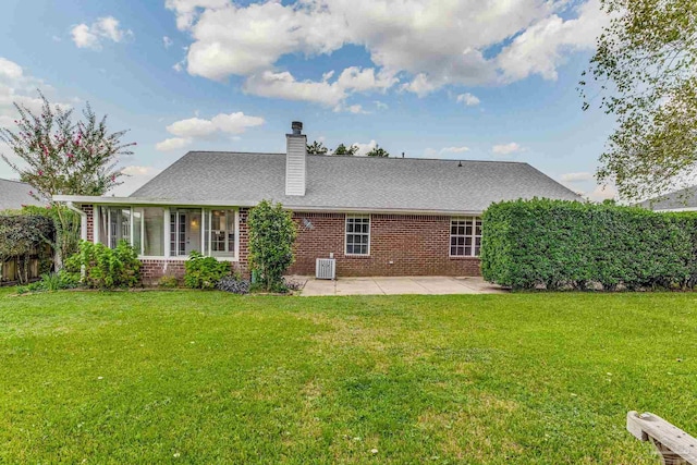 back of house with a lawn, a patio, and central air condition unit