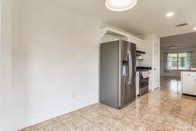 kitchen with ceiling fan, stainless steel appliances, and white cabinetry