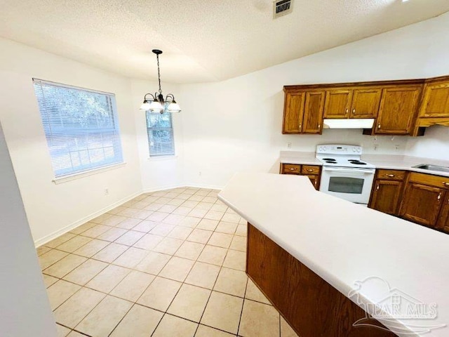 kitchen featuring electric stove, a chandelier, light tile patterned floors, pendant lighting, and a textured ceiling