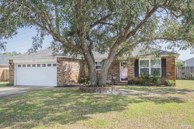 ranch-style house with a front yard and brick siding