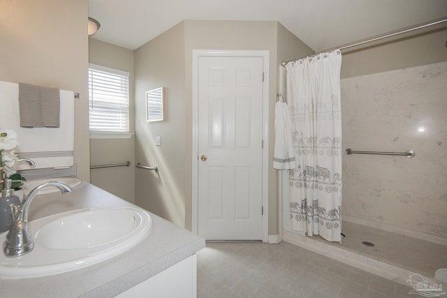 full bathroom with a sink, curtained shower, and double vanity