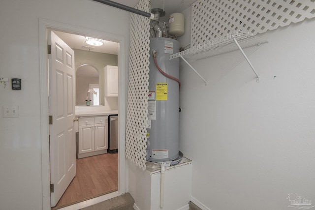 utility room featuring water heater