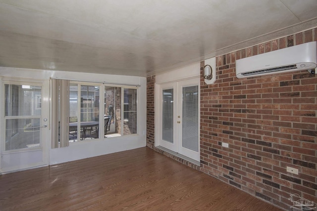 unfurnished sunroom with french doors and an AC wall unit