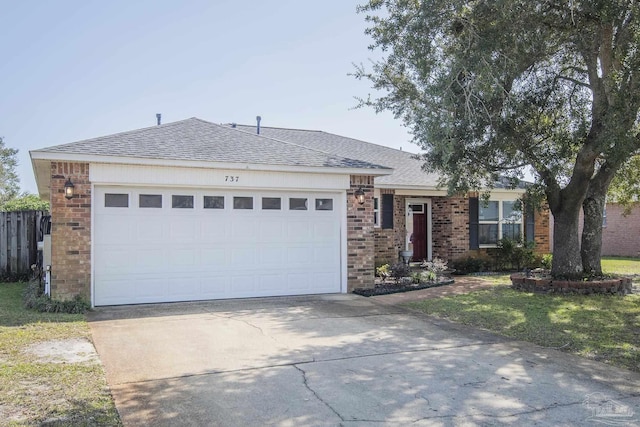 single story home with brick siding, concrete driveway, a shingled roof, and a garage