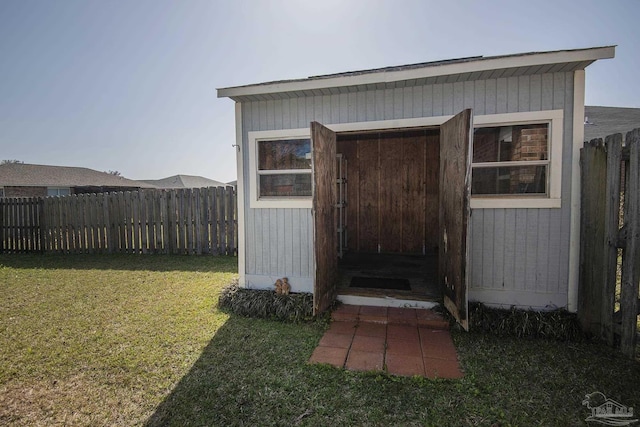 view of shed with a fenced backyard