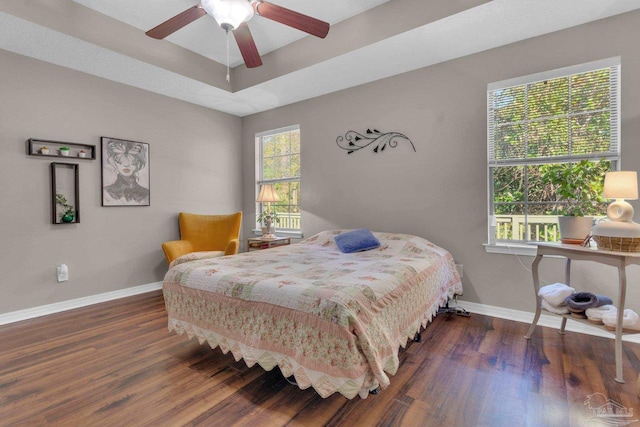 bedroom featuring dark wood-type flooring and ceiling fan