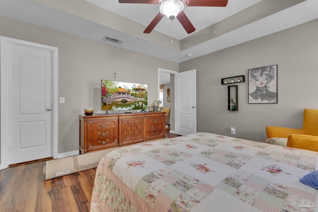 bedroom featuring hardwood / wood-style flooring and ceiling fan