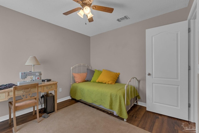 bedroom featuring wood-type flooring and ceiling fan