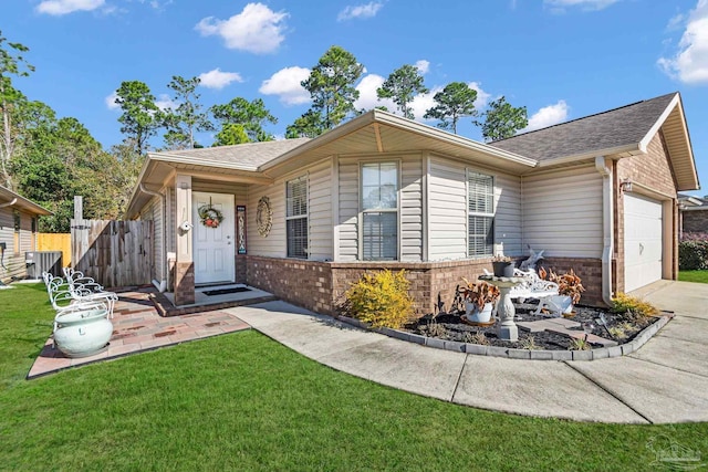 ranch-style house featuring a garage, central air condition unit, and a front lawn