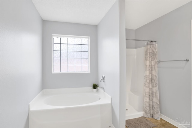 bathroom featuring independent shower and bath