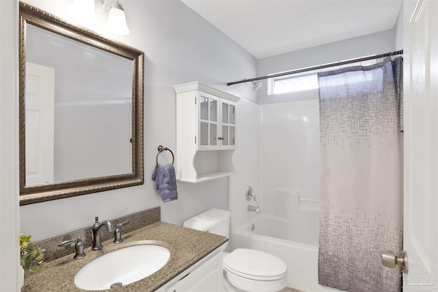 full bathroom with shower / bath combo, vanity, and toilet