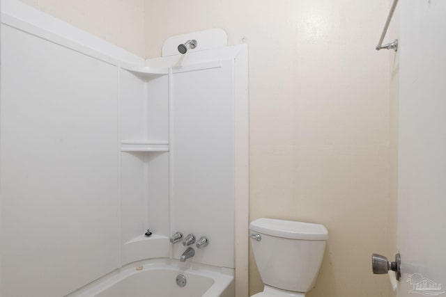 bathroom with shower / washtub combination and toilet