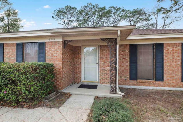 entrance to property with brick siding