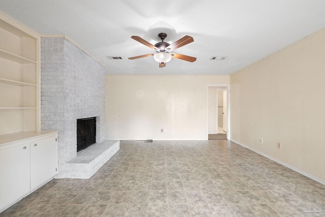 unfurnished living room featuring a brick fireplace, built in shelves, visible vents, and a ceiling fan