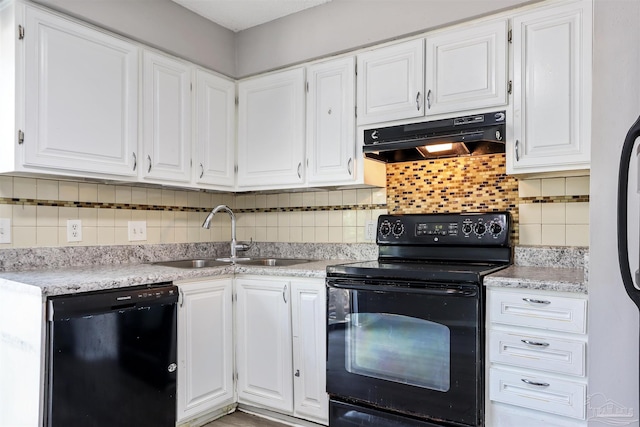 2811 Langley Ave Unit 221, Pensacola, FL 32504 - kitchen with black appliances, under cabinet range hood, a sink, and white cabinetry