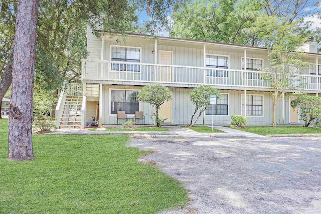 2811 Langley Ave Unit 221, Pensacola, FL 32504 - view of front facade with a front yard and stairs
