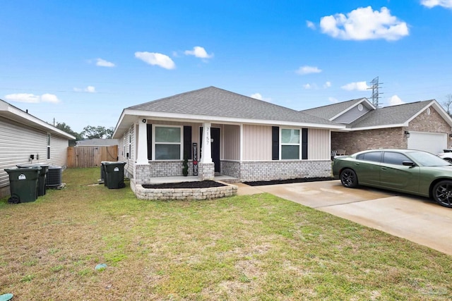 view of front facade featuring covered porch, a front yard, and central air condition unit