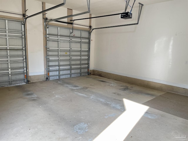 garage featuring baseboards and a garage door opener
