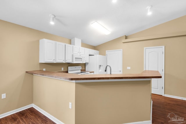 208 Millet Cir, Cantonment, FL 32533 - kitchen featuring white appliances, dark wood-style floors, vaulted ceiling, and baseboards