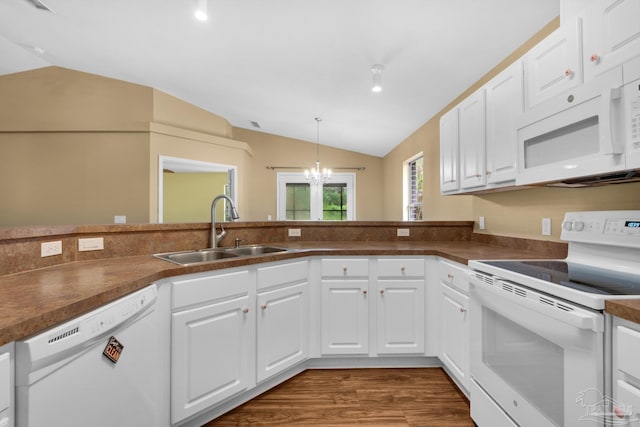 208 Millet Cir, Cantonment, FL 32533 - kitchen featuring dark countertops, a sink, lofted ceiling, and white appliances