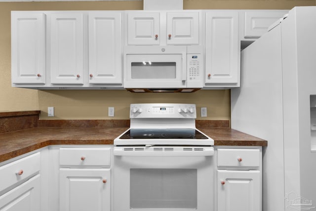 208 Millet Cir, Cantonment, FL 32533 - kitchen featuring dark countertops, white appliances, and white cabinets