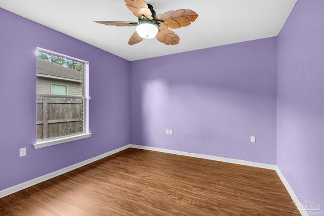208 Millet Cir, Cantonment, FL 32533 - unfurnished room with wood finished floors, a ceiling fan, and baseboards