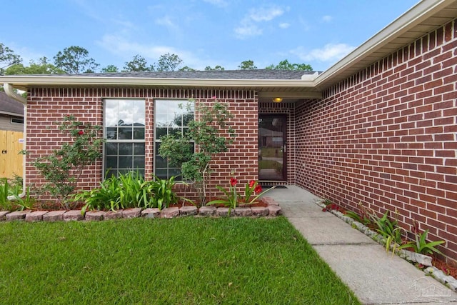208 Millet Cir, Cantonment, FL 32533 - property entrance with a yard and brick siding