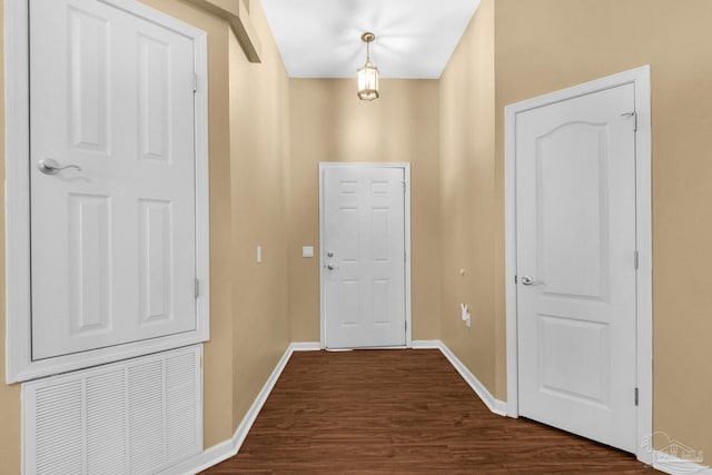 208 Millet Cir, Cantonment, FL 32533 - doorway to outside with baseboards, visible vents, and dark wood-style floors