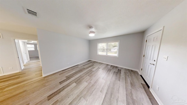 spare room featuring light wood-type flooring