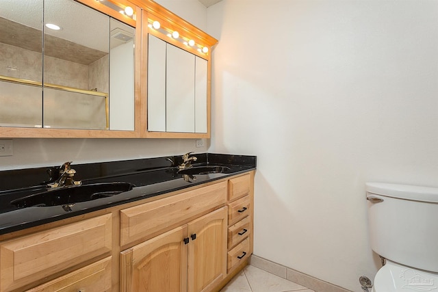 1090 Park Ln, Gulf Breeze, FL 32563 - full bathroom with a sink, tile patterned flooring, toilet, and double vanity