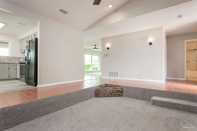 1090 Park Ln, Gulf Breeze, FL 32563 - living room featuring visible vents, ceiling fan, light tile patterned flooring, and light carpet