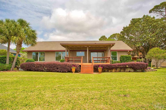 1090 Park Ln, Gulf Breeze, FL 32563 - back of house with a lawn and a porch