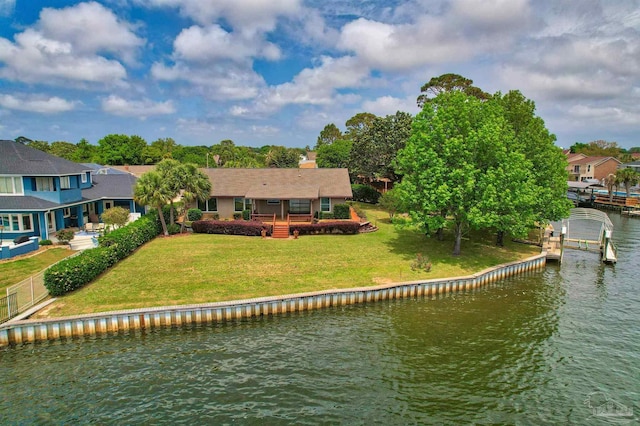 1090 Park Ln, Gulf Breeze, FL 32563 - rear view of property with a lawn, a water view, fence, and a chimney