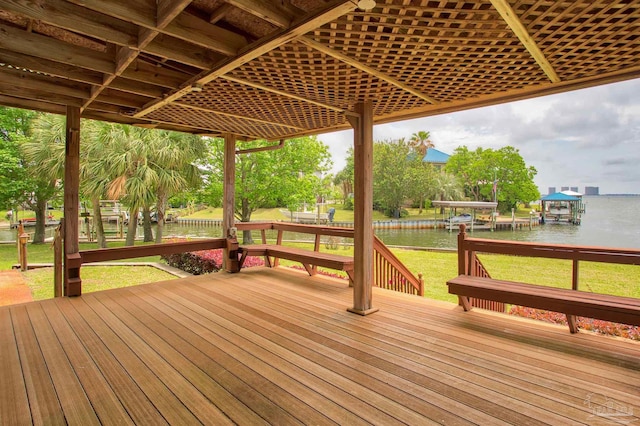 1090 Park Ln, Gulf Breeze, FL 32563 - wooden deck featuring a yard, a water view, boat lift, and a boat dock