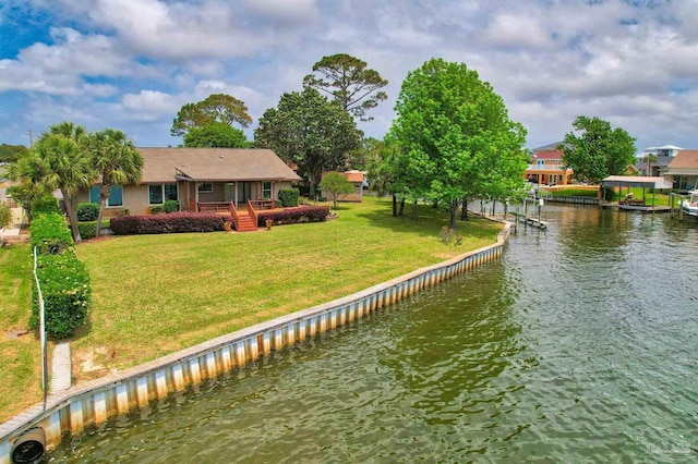 1090 Park Ln, Gulf Breeze, FL 32563 - view of dock with a lawn and a water view