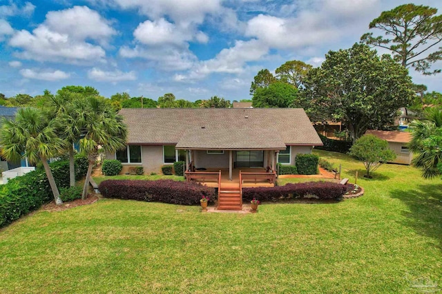 1090 Park Ln, Gulf Breeze, FL 32563 - back of house featuring a lawn and a shingled roof