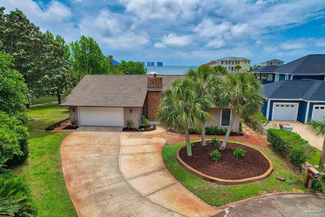 1090 Park Ln, Gulf Breeze, FL 32563 - view of front facade with a residential view, an attached garage, a front yard, a chimney, and concrete driveway